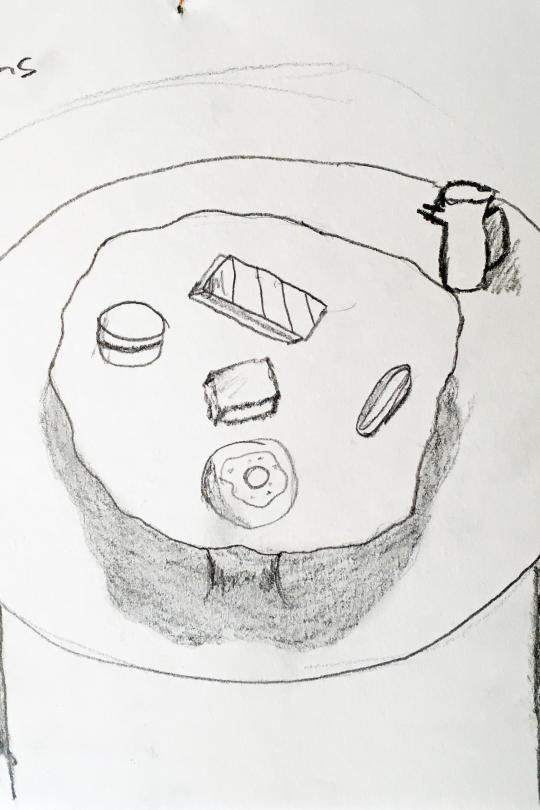 dessin au crayon d'une table dressée avec des petits gâteaux